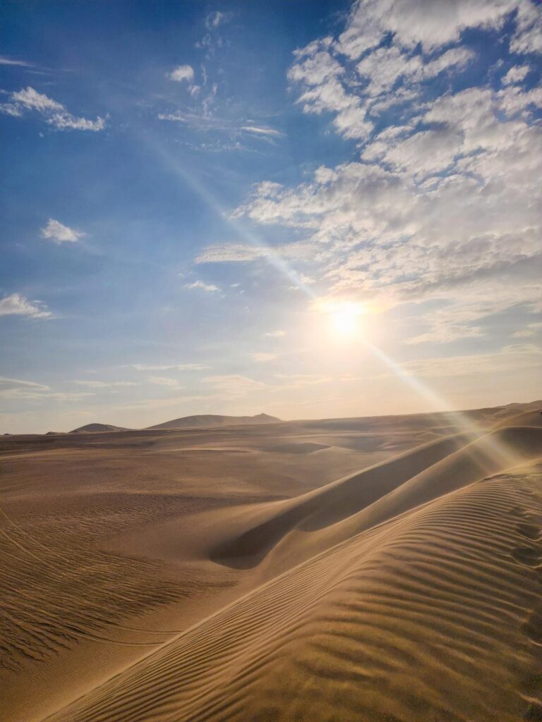 Watch the sunset over the Ica Desert on your day trip from Lima. 