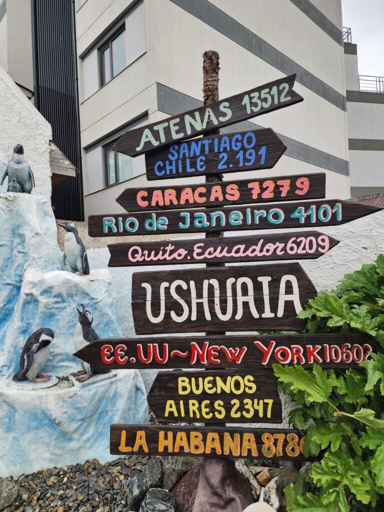 distance miles kilometers sign in Ushuaia Argentina gift shop