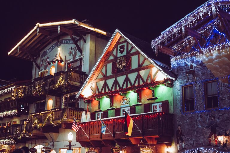 Charming Bavarian-style building in Leavenworth illuminated with festive lights at night.